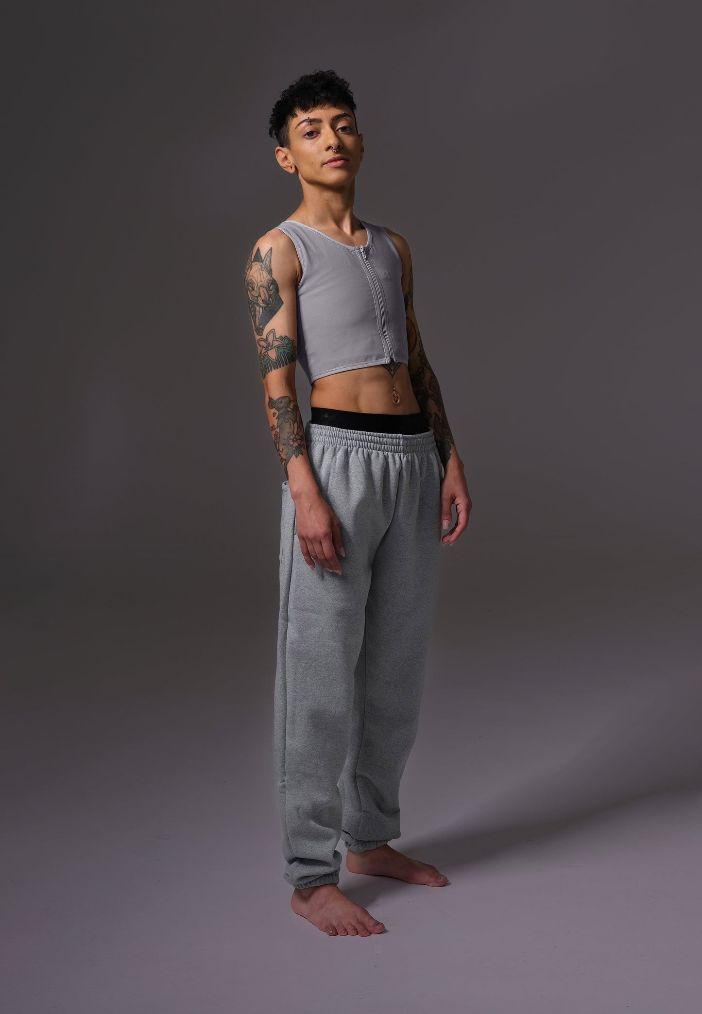UNTAG ftm chest binder trans non binary underwear basic zipper grey model 2 front lean