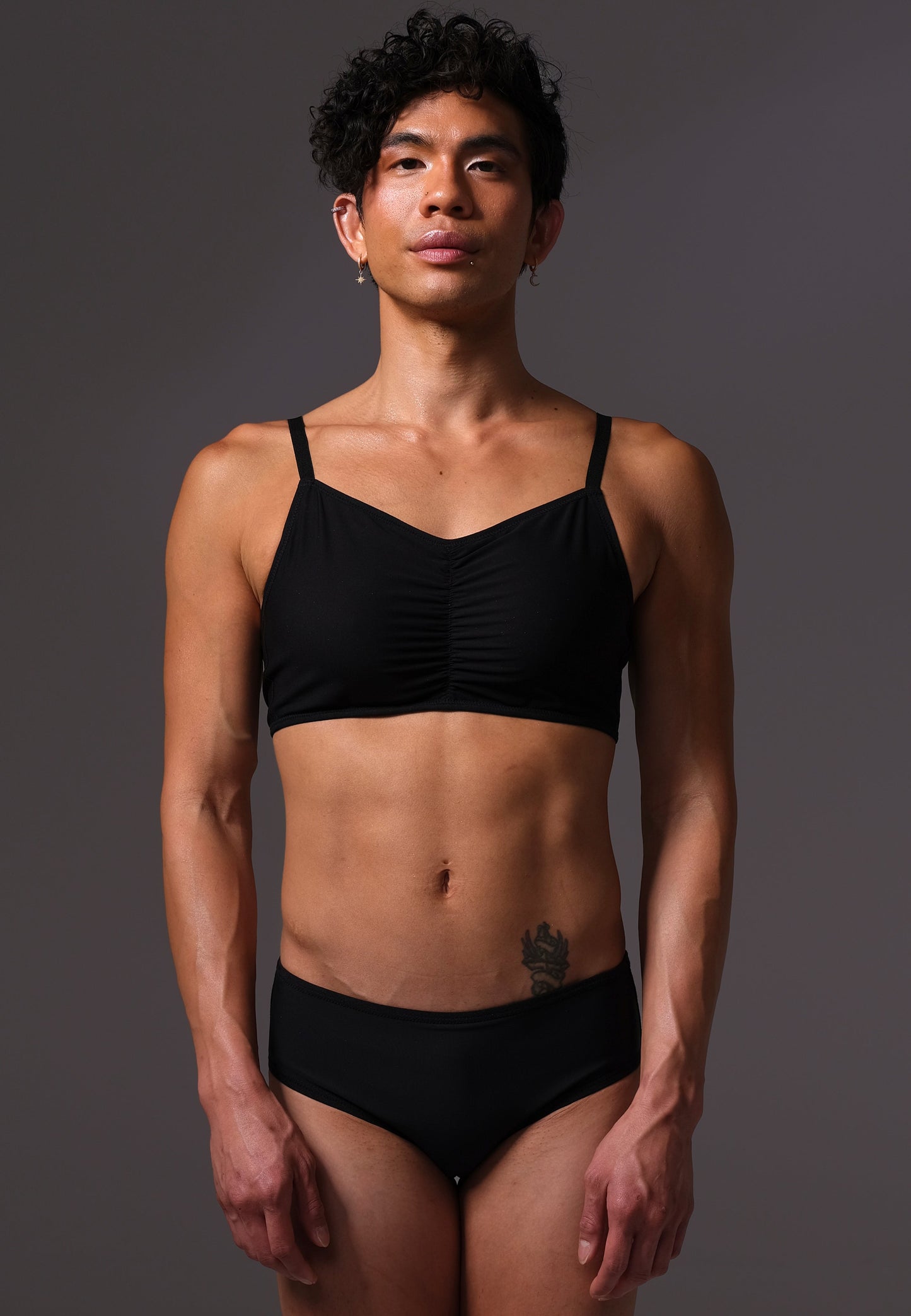 MtF trans femme UNTAG black bikini top front close up model