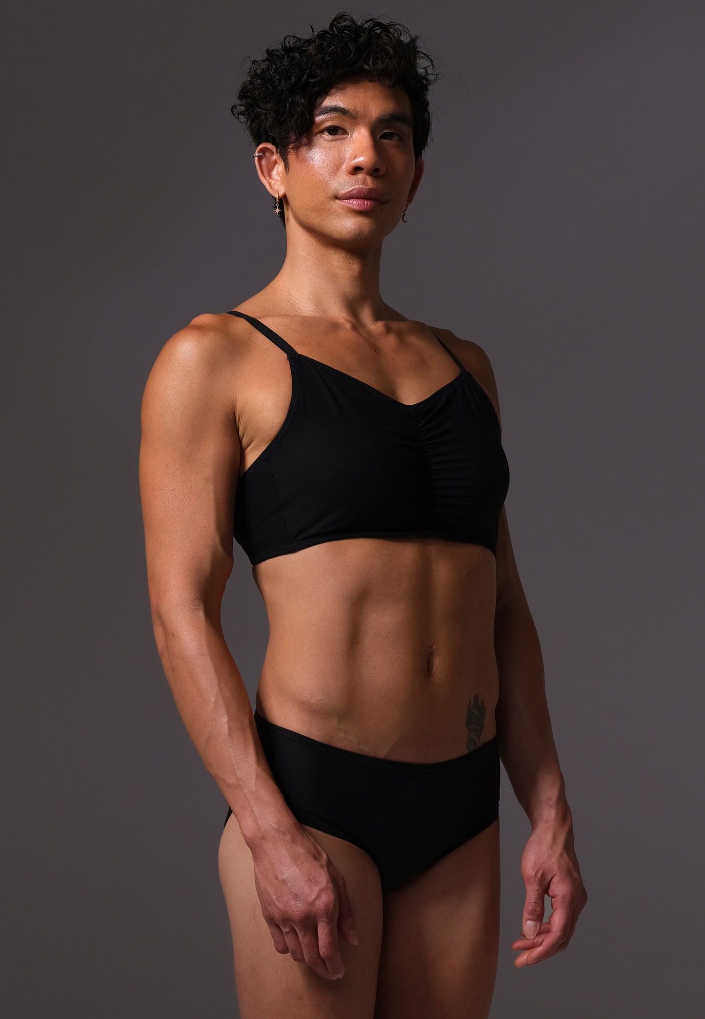 MtF trans femme UNTAG black bikini top side front close up model