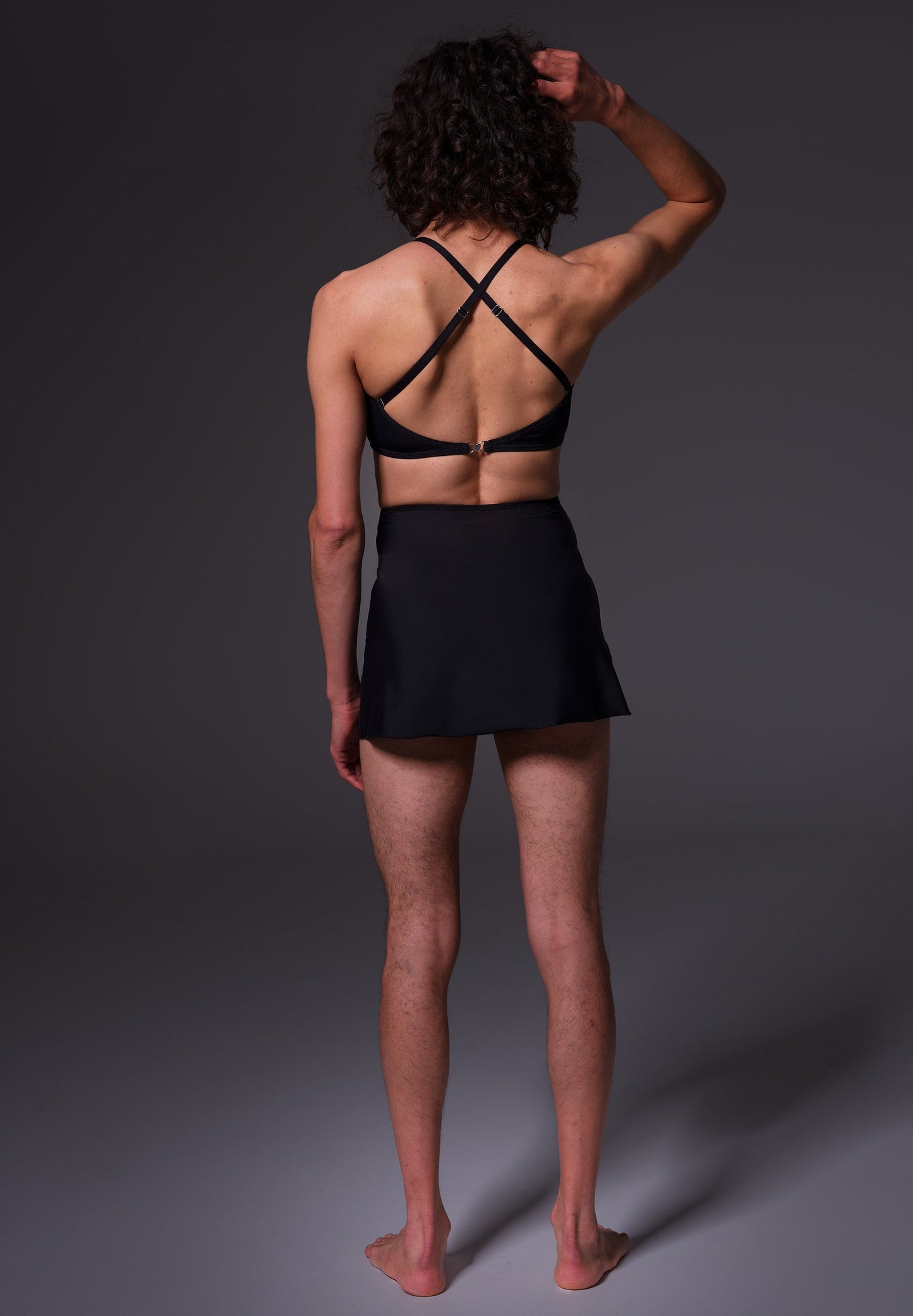 Swim Skirt in black, seen from the back on Riah