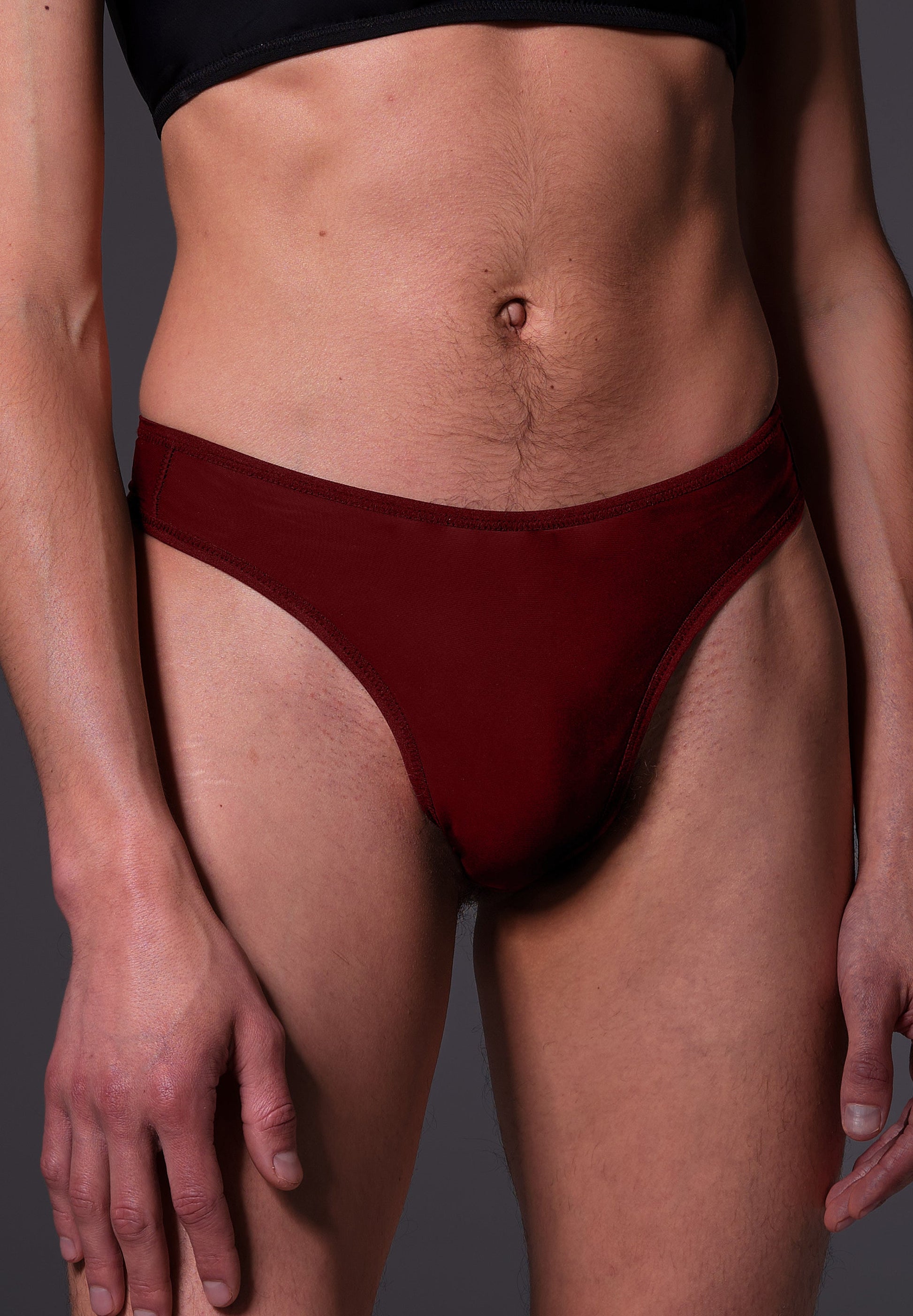 UNTAG MtF trans femme tucking thong extra strong burgundy red model front close up 