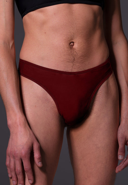 UNTAG MtF trans femme tucking thong extra strong burgundy red model front close up 