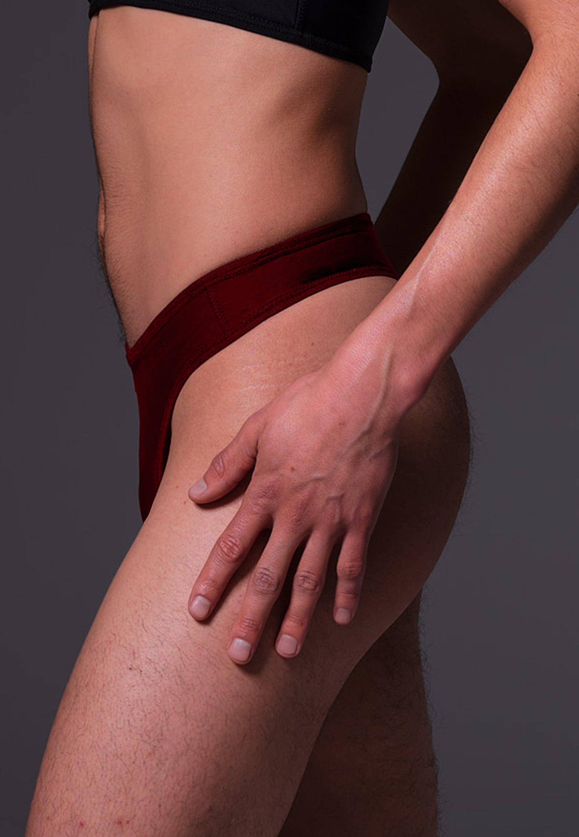 UNTAG MtF trans femme tucking thong extra strong burgundy red model side close up 