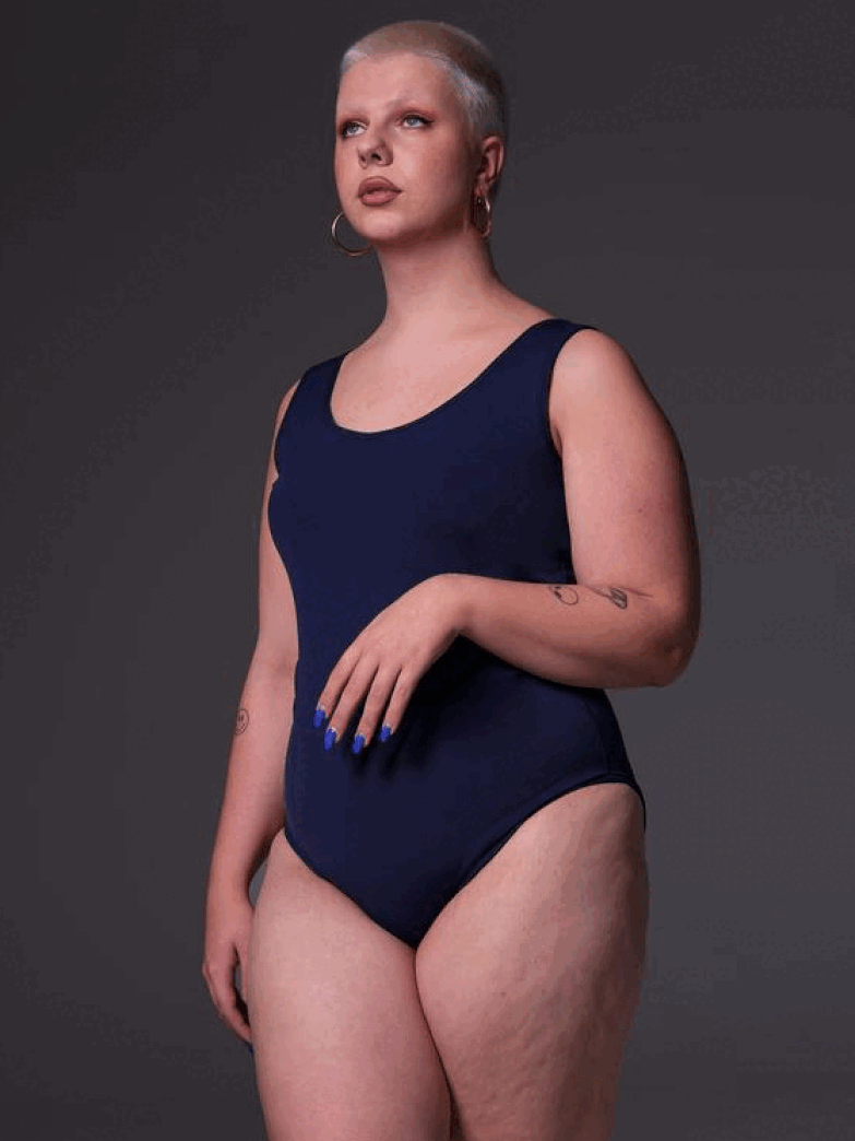 Sasha is shown from three sides wearing the Swimsuit in dark blue