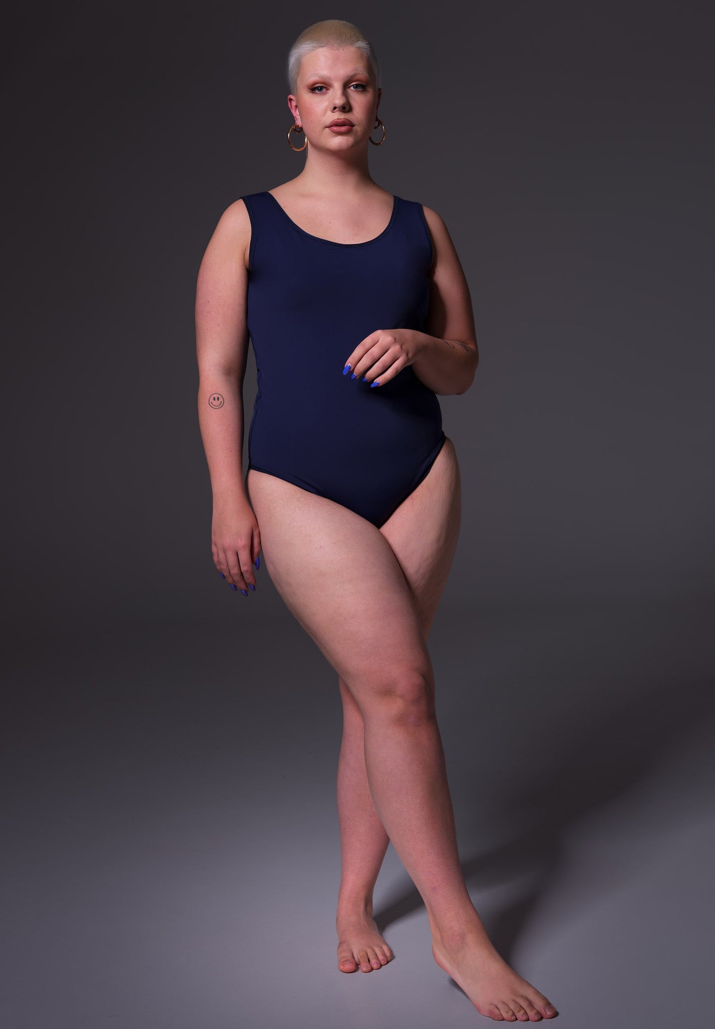 Front view of the Swimsuit dark blue, modelled by Sasha