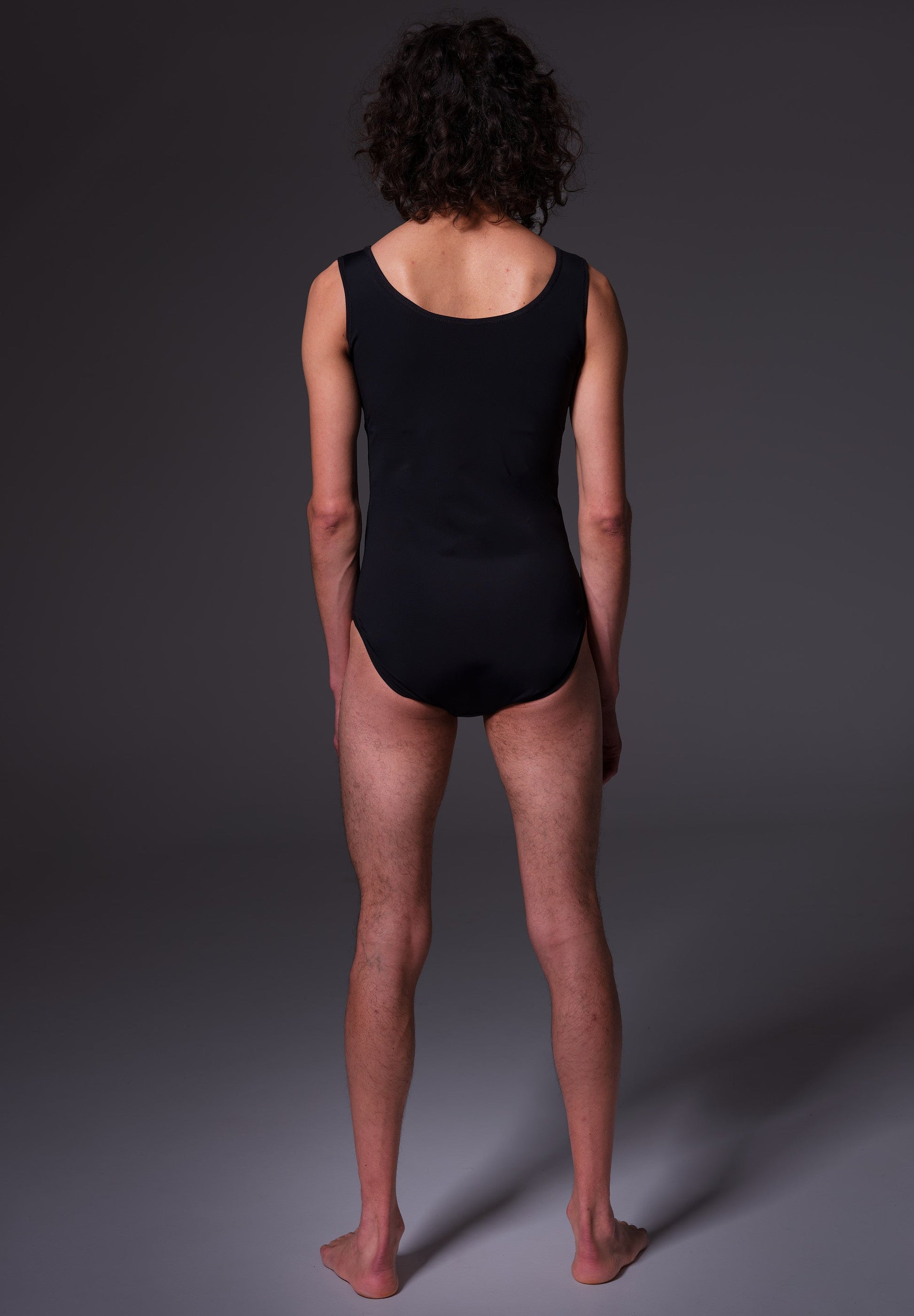 Swimsuit black, seen from the back on model Riah