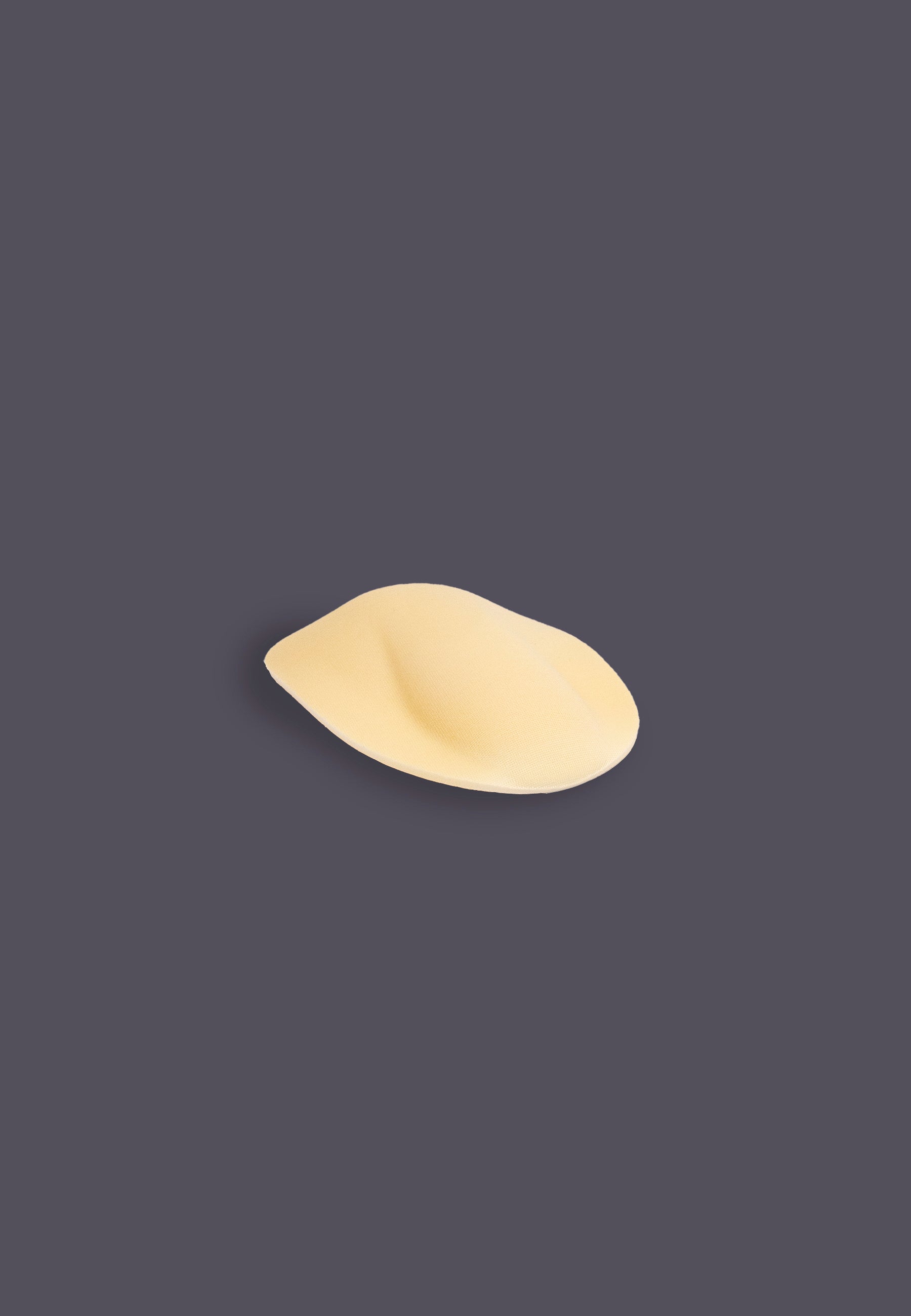 Foam Penis Padding with shape beige, side view when flat